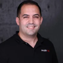 Frank Diaz, President and CEO of Pagertec, in a black Pagertec polo shirt.